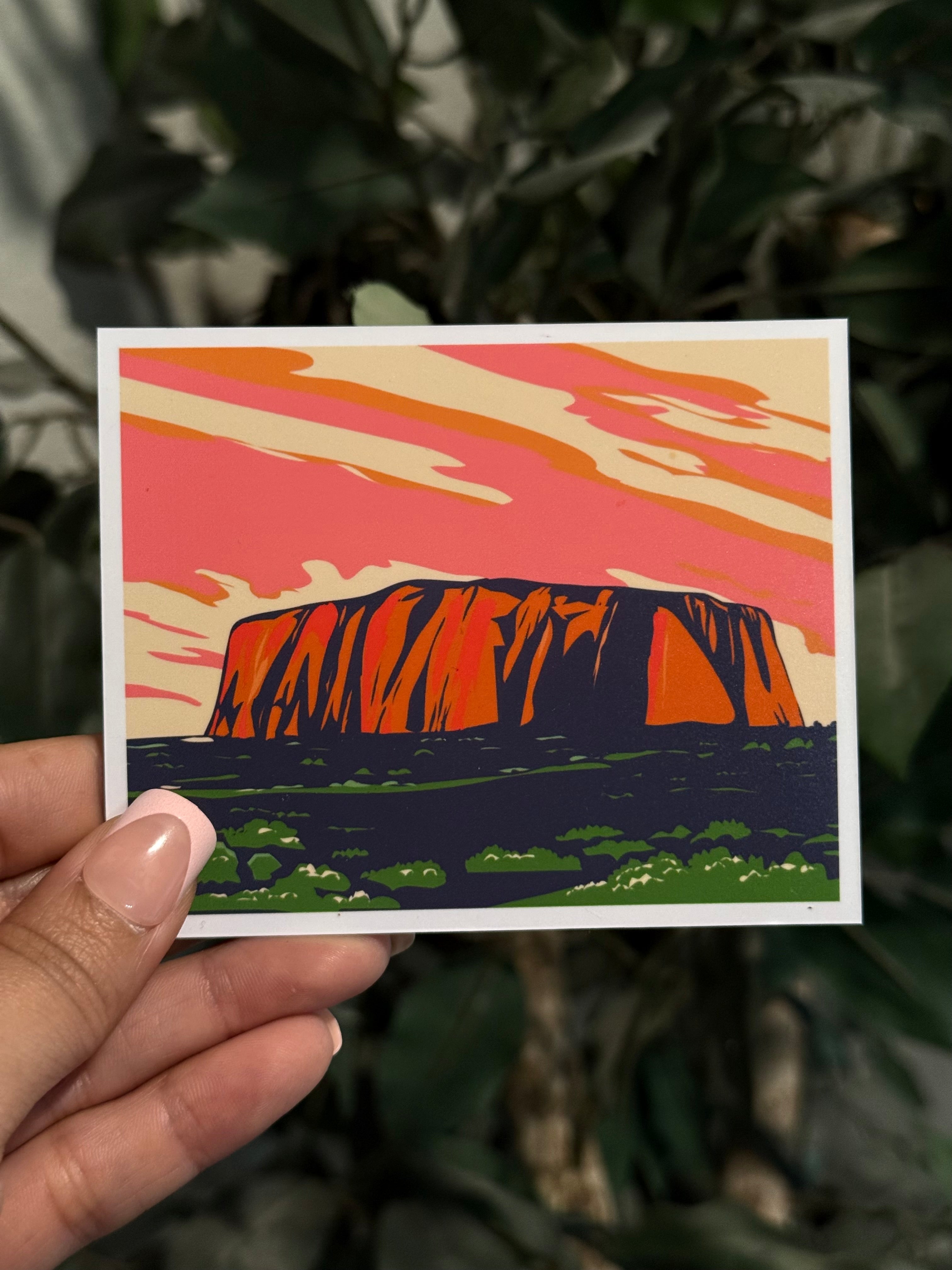 Berry Large photo magnet with picture of Uluru against a pink sky held in front of green leaves